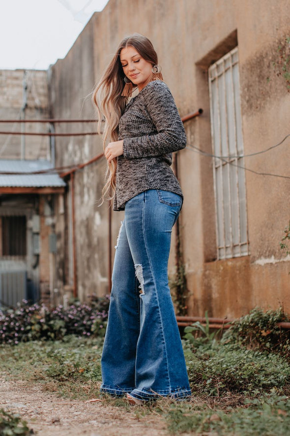 Mid Rise Mid Wash Flare Jeans with Distress Detail